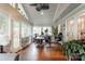 Bright sun room with multiple windows, ceiling fan and neutral paint at 8532 Piccone Brook Ln, Charlotte, NC 28216