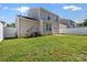 Fenced backyard with green grass and a small patio, perfect for outdoor enjoyment and privacy at 8610 Sawleaf Ct, Charlotte, NC 28215