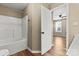 Bathroom featuring a shower-tub combination and a door to the main bedroom at 8610 Sawleaf Ct, Charlotte, NC 28215