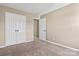 Bedroom featuring plush carpet and closet doors at 8610 Sawleaf Ct, Charlotte, NC 28215