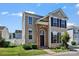 Inviting two-story home with brick archway, black shutters, and lush green lawn at 8610 Sawleaf Ct, Charlotte, NC 28215