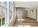 Spacious living room filled with natural light and featuring new hardwood floors at 8610 Sawleaf Ct, Charlotte, NC 28215