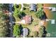 Aerial view of the property showcasing lake access, dock, driveway and mature trees at 9561 Island Point Rd, Sherrills Ford, NC 28673