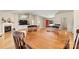 Dining area featuring an open layout with access to the kitchen and a cozy living room at 9561 Island Point Rd, Sherrills Ford, NC 28673