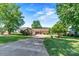 Charming single-story home with a well-manicured lawn and long driveway at 9561 Island Point Rd, Sherrills Ford, NC 28673