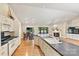 Open-concept kitchen leading to a dining area and living space with a fireplace, ideal for entertaining guests at 9561 Island Point Rd, Sherrills Ford, NC 28673