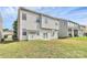 Fenced backyard with green grass and patio sliding glass doors at 10606 Gallowgate Ln, Charlotte, NC 28213