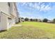 Expansive backyard featuring a well-maintained lawn and ample space for outdoor activities and landscaping opportunities at 10606 Gallowgate Ln, Charlotte, NC 28213