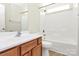 Bathroom with a white vanity and bath-shower combo at 10606 Gallowgate Ln, Charlotte, NC 28213