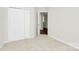 Bedroom with neutral carpet and bright white closet doors at 10606 Gallowgate Ln, Charlotte, NC 28213