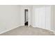 Bedroom with neutral carpet, closet, and doorway view at 10606 Gallowgate Ln, Charlotte, NC 28213