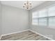 Bright dining room illuminated by natural light and featuring modern floors at 10606 Gallowgate Ln, Charlotte, NC 28213