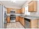 Bright kitchen features stainless steel appliances, new floor, and granite countertops at 10606 Gallowgate Ln, Charlotte, NC 28213