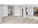 Open-concept living area featuring hardwood floors and archways to adjacent rooms at 10606 Gallowgate Ln, Charlotte, NC 28213