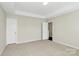 Spacious main bedroom featuring neutral colored walls and carpet at 10606 Gallowgate Ln, Charlotte, NC 28213