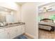 Bright bathroom with granite counters and shower through to the bedroom at 107 S Sina St, Troutman, NC 28166