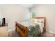 Cozy bedroom with carpet and natural light through a large window at 107 S Sina St, Troutman, NC 28166