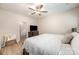 Bedroom with a view into the hallway, a ceiling fan, and soft decor for relaxation at 107 S Sina St, Troutman, NC 28166