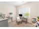 Well-lit office area with a desk and a large window view at 107 S Sina St, Troutman, NC 28166