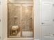 Modern glass shower with bench and tiled walls at 107 S Sina St, Troutman, NC 28166