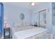 Light and airy bedroom with sliding mirror closet, ceiling fan, and a round mirror adds a stylish touch at 108 Britt Ln, New London, NC 28127