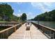Dock featuring picnic table and bench with a beautiful panoramic water view at 108 Britt Ln, New London, NC 28127