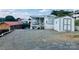 Exterior view of home, with a shed and a gravel driveway, offering a practical and low-maintenance setup at 108 Britt Ln, New London, NC 28127