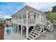 Charming cottage-style home featuring a large screened porch and inviting outdoor living space at 108 Britt Ln, New London, NC 28127