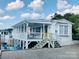 Charming single-story home featuring a large screened porch and inviting curb appeal at 108 Britt Ln, New London, NC 28127