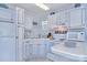 Bright kitchen equipped with refrigerator, stove, microwave and ample storage at 108 Britt Ln, New London, NC 28127