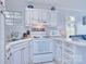 Cozy kitchen featuring white appliances and unique design elements at 108 Britt Ln, New London, NC 28127