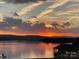 Scenic lake view at sunset, showing calm waters and stunning sky reflections at 108 Britt Ln, New London, NC 28127