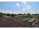 Community mini golf area features well-maintained greens, landscaping, and a fun recreational amenity for residents at 108 Britt Ln, New London, NC 28127