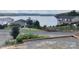 Scenic neighborhood view showcasing homes nestled near the lake, offering picturesque waterfront living at 108 Britt Ln, New London, NC 28127