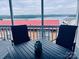 Enjoy tranquil lake views from this screened porch with comfortable seating and a relaxing ambiance at 108 Britt Ln, New London, NC 28127