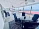 Relax on this inviting porch with comfortable seating, ceiling fans, and picturesque lake views at 108 Britt Ln, New London, NC 28127