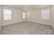 Neutral bedroom with plush carpeting and ample natural light, creating a serene atmosphere at 111 Canoga Ave, York, SC 29745