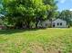 Spacious, grassy backyard lined with mature trees and a privacy fence at 1111 Unionville Church Rd, Monroe, NC 28110