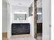 Bathroom featuring an updated vanity with a rectangular mirror, tile flooring, and a glass door shower at 1111 Unionville Church Rd, Monroe, NC 28110
