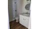 Bathroom featuring a walk-in shower, granite countertop vanity, and hardwood floors at 1111 Unionville Church Rd, Monroe, NC 28110