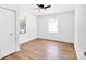 Bright bedroom featuring a ceiling fan, closet and a large window overlooking the yard at 1111 Unionville Church Rd, Monroe, NC 28110