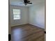 Bedroom featuring hardwood flooring, a closet, and natural light from the window at 1111 Unionville Church Rd, Monroe, NC 28110