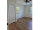 Cozy bedroom featuring hardwood flooring, a closet, and natural light from the window at 1111 Unionville Church Rd, Monroe, NC 28110