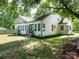 Back exterior view of home with an addition including multiple windows and a set of French doors at 1111 Unionville Church Rd, Monroe, NC 28110