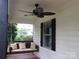 Inviting front porch featuring a cozy porch swing and a ceiling fan for relaxation at 1111 Unionville Church Rd, Monroe, NC 28110