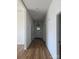 Hallway with hardwood flooring, neutral walls, and access to multiple rooms at 1111 Unionville Church Rd, Monroe, NC 28110