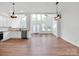 Open-concept living space with hardwood floors and ample natural light from large windows at 1111 Unionville Church Rd, Monroe, NC 28110