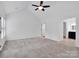 Spacious main bedroom featuring neutral carpet, a vaulted ceiling, and an overhead ceiling fan at 1111 Unionville Church Rd, Monroe, NC 28110