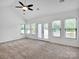Bright main bedroom with neutral carpet, plenty of windows, and an overhead ceiling fan at 1111 Unionville Church Rd, Monroe, NC 28110