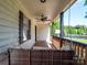 Inviting front porch with a swing, perfect for relaxing and enjoying the outdoors at 1111 Unionville Church Rd, Monroe, NC 28110